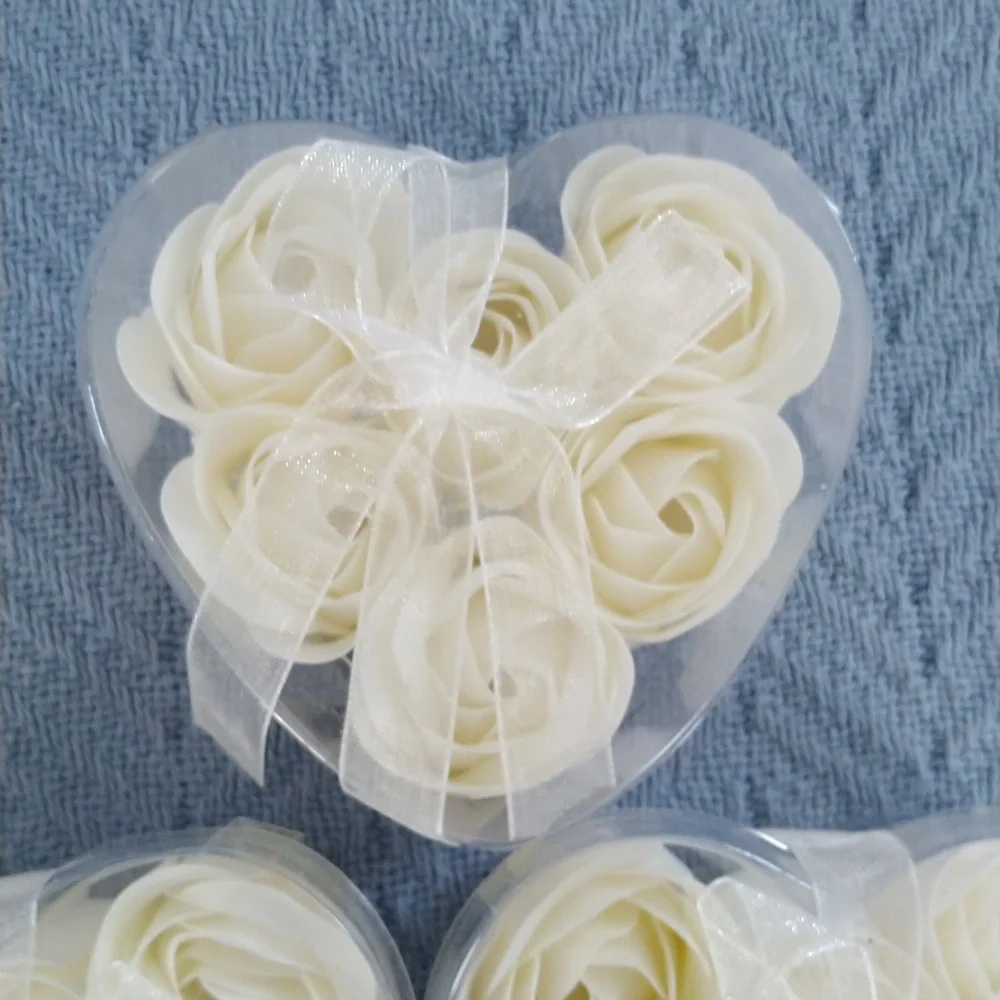 Rose petal soaps in white. Set of 3 hearts, each containing 6 soaps.